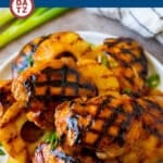 A plate of huli huli chicken featuring savory grilled chicken and sweet pineapple.