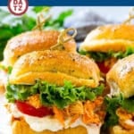 A plate with several buffalo chicken sliders.